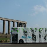 Travelling Gallery parked in front of Greek style acropolis on Calton Hill in Edinburgh